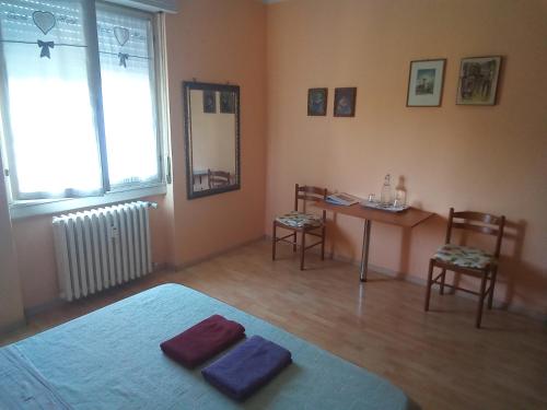 Postel nebo postele na pokoji v ubytování Stanza ai Colli