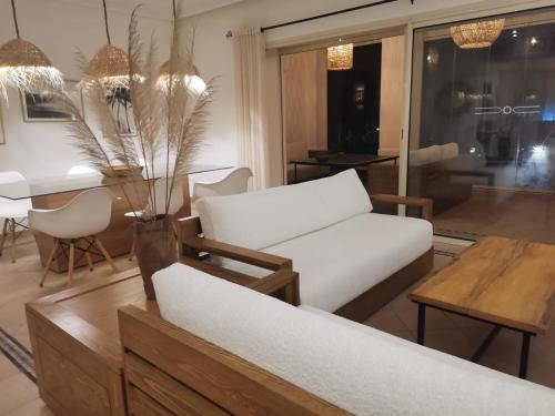 a living room with a couch and a table at Stylish Villa 5 Minutes to Agadir Beach in Agadir