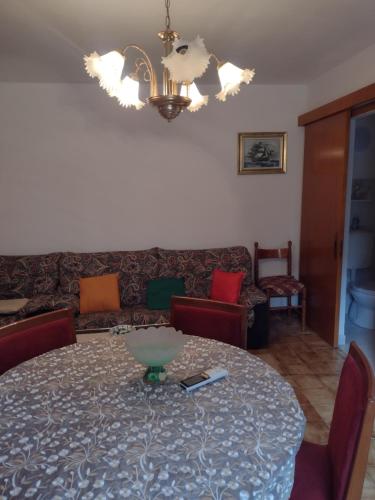 a living room with a table and a couch at Viepri centro in Rocchette