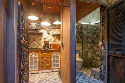 a bathroom with a shower and a toilet in a room at Apartamentos CV Calderería Vieja in Granada