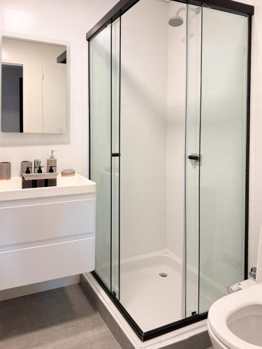 a bathroom with a glass shower and a sink at Anywhere Palermo Soho in Buenos Aires