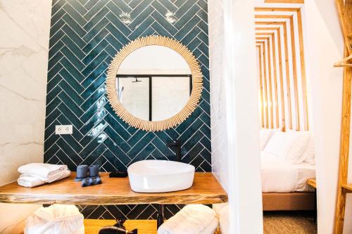 a bathroom with a mirror and a sink at The Lost Garden in Vila Nova de Gaia