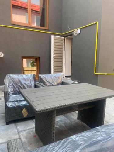 a table and two couches in a room at Discovery Garden apartments in Khmelʼnytsʼkyy