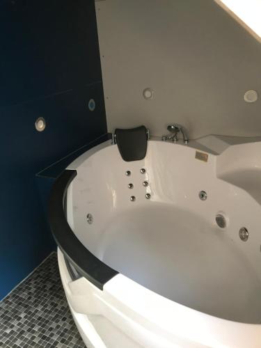 a large white bath tub in a room at Ferienwohnung zentrale ruhige Lage auch gerne mit Kindern in Arbon