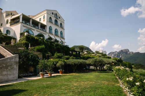 a building with a lawn in front of it at Caruso, A Belmond Hotel, Amalfi Coast in Ravello