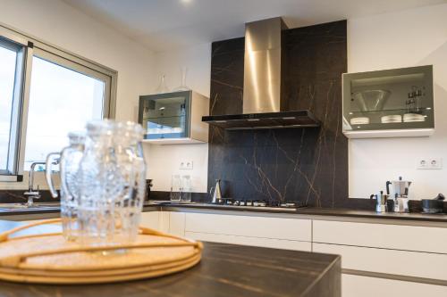 a kitchen with a glass jar on a table at Kyuka Surfclub in Lajares
