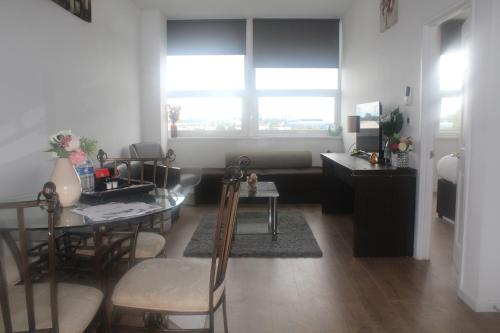 a living room with a table and a dining room at Flat 409 One bedroom apartment in Birmingham