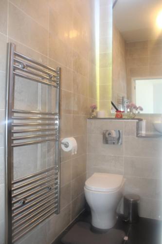 a bathroom with a toilet and a sink at Flat 409 One bedroom apartment in Birmingham