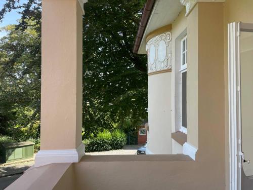 a view of the side of a house with a window at Villa Deichvoigt in Cuxhaven