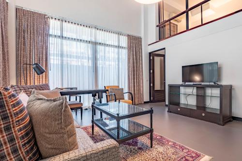 Телевизор и/или развлекательный центр в Luxe Residence