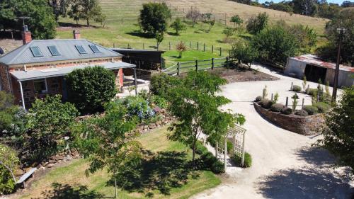 an aerial view of a house with a driveway at Gabby's Cottage in Clarendon