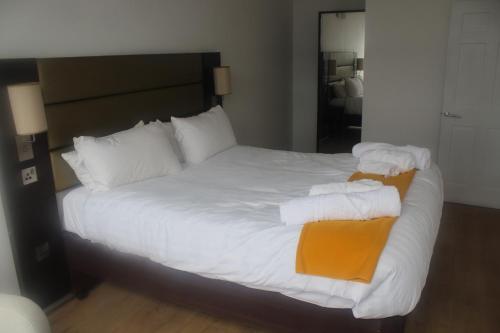 a bedroom with a bed with two towels on it at Flat 404 One bedroom apartment in Birmingham