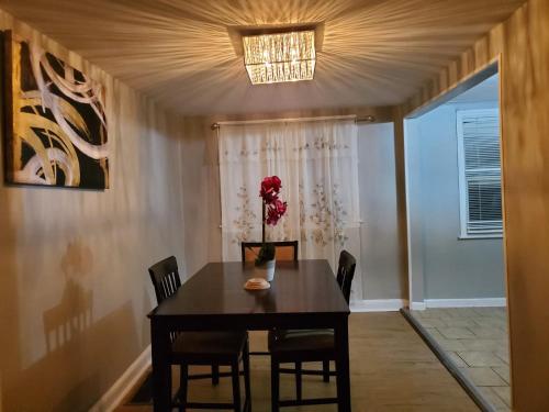 a dining room with a table and chairs at Paradise Retreat by the Airport in Collingdale