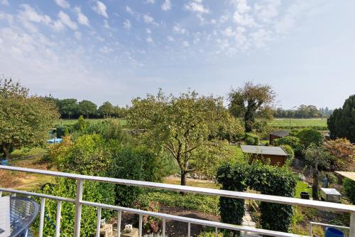 a view of a garden from a balcony at Ruhiges Appartement Am Stadtrand in Kevelaer