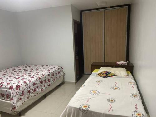 a bedroom with a bed in a room at Chácara Recanto Monjolinho in Planaltina