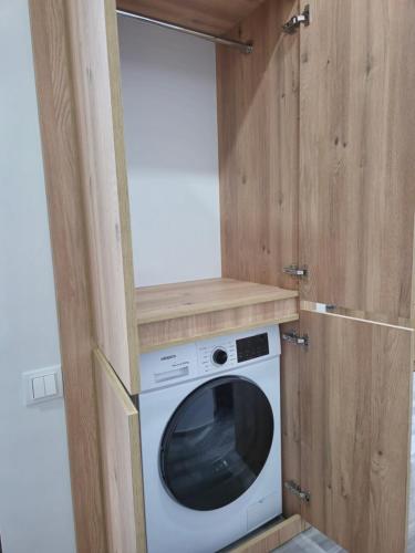 a washer and dryer in a tiny house at Next 1411 in Kakhaberi