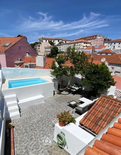 a view from the roof of a house with a swimming pool at Castelo Terrace in Lisbon