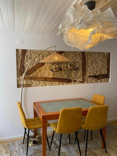 a dining room with a table and two chairs at Castelo Terrace in Lisbon