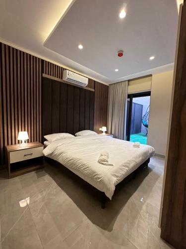 Ένα ή περισσότερα κρεβάτια σε δωμάτιο στο Chic Apartments For Rent ave0-3