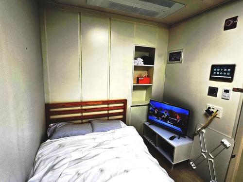 Ένα ή περισσότερα κρεβάτια σε δωμάτιο στο Apartment within a 1-minute walk from the 3-minute bus stop at Gochon Station
