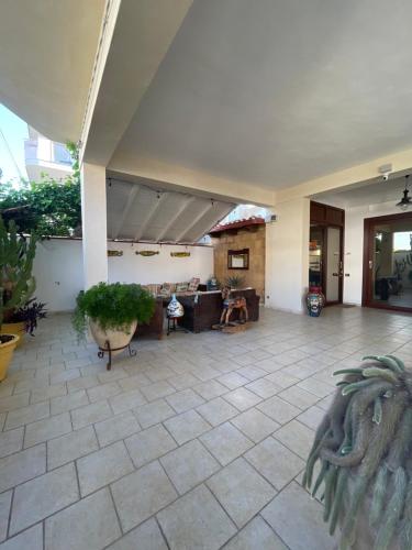 a large living room with a couch and a table at Villa Joseph in Marzamemi