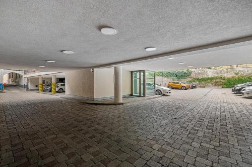 an empty parking lot with cars parked in a garage at Downtown Bratislava B&B in Bratislava