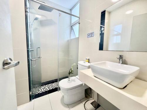 a bathroom with a sink and a toilet and a shower at SD 1-10Pax Puchong Sky Pod Residence IOI Mall WiFi in Puchong