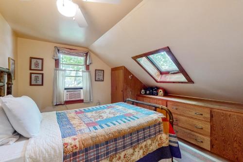 a bedroom with a bed and a window and a dresser at Bomoseen Fever in Bomoseen