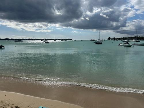 a view of a harbor with boats in the water at Coastal View Apartments in Grand Baie