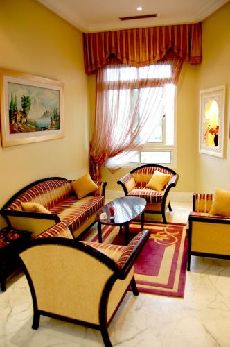 a living room with two couches and a window at Hotel la princesse in Tunis