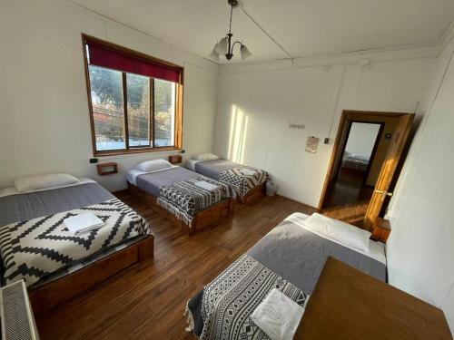 Postel nebo postele na pokoji v ubytování Hostal Ochen