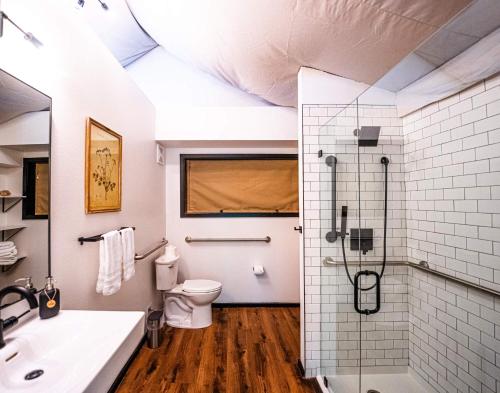 a bathroom with a shower and a toilet at Starlight Haven at Weiss Lake in Gaylesville