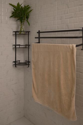 a towel hanging on a towel rack in a bathroom at Sunset beach villa 7 O3 villas in Haad Pleayleam