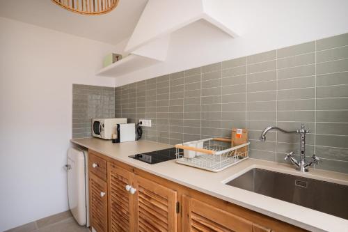 Kuchyň nebo kuchyňský kout v ubytování Apartamentos Punta Rasa