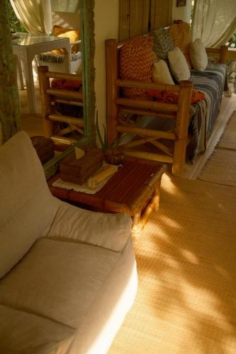 a room with a bed and a couch and a mirror at Sunset beach villa 7 O3 villas in Haad Pleayleam