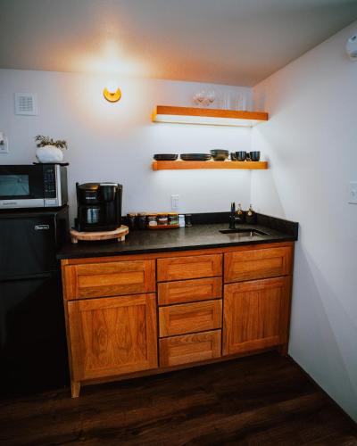 a kitchen with a sink and a microwave at Starlight Haven at Weiss Lake in Gaylesville