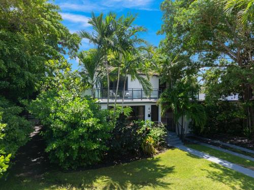 an exterior view of a white house with trees at The Waterhouse- Amazing Villa With Infinity Pool in Miami