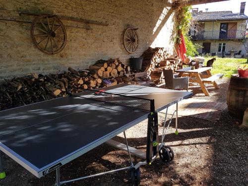 a ping pong table in front of a fire pit at Le Chateau in Sainte-Agnès