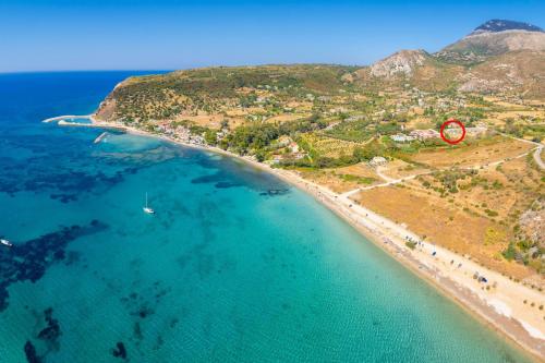 an aerial view of a beach with a red sign at Villa Margarita in Katelios