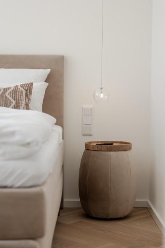 a bed room with a table next to a bed at Apartments Hotel Stadt Hamburg in Westerland (Sylt)