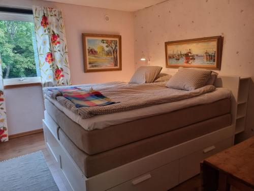 a large bed in a room with a window at Haby House Old in Skene