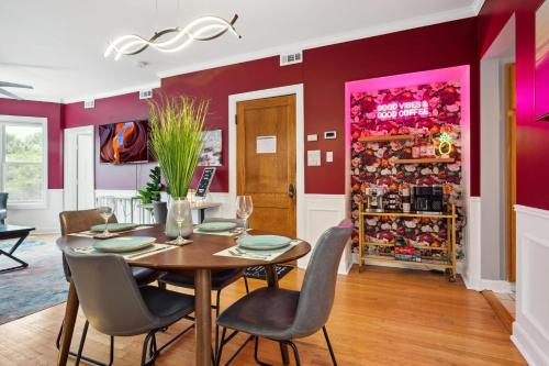 a dining room with red walls and a table and chairs at Wrigley 2BR, 1BA with Free Parking in Chicago
