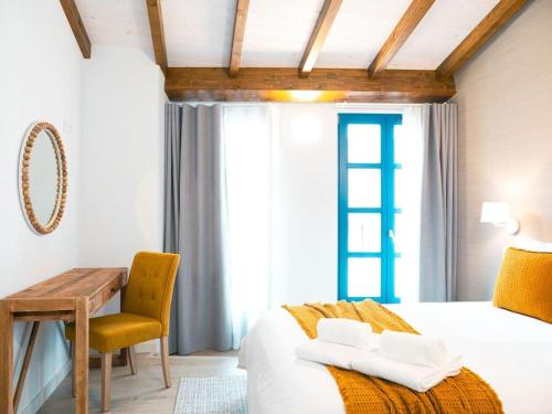 En eller flere senge i et værelse på Casa del Puerto