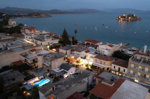 an aerial view of a town by the water at night at Centro Stone House in Tolo