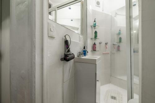 a white bathroom with a sink and a shower at Casa Itzae B&B Polanquito Dog Friendly in Mexico City