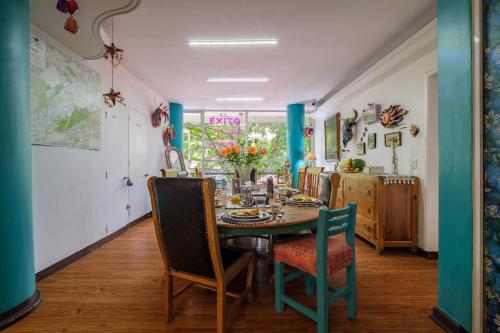 a dining room with a table and chairs at Casa Itzae B&B Polanquito Dog Friendly in Mexico City