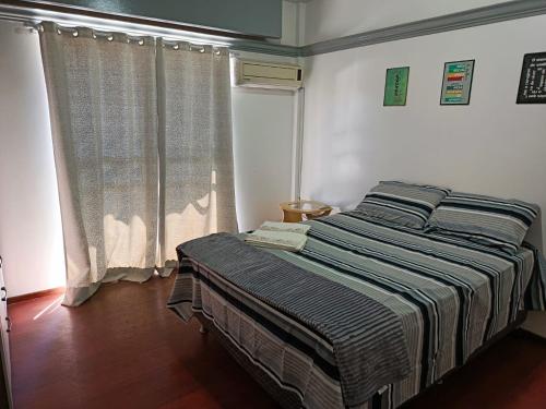 Postel nebo postele na pokoji v ubytování Quarto sossego do Ale