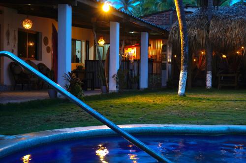 a hose in front of a house at night at Bella Vista Hotel Boutique in San Miguel