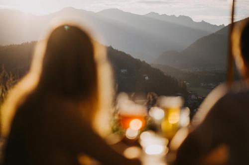a group of people looking out at the mountains at Salzbergalm in Berchtesgaden