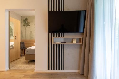 Μια τηλεόραση ή/και κέντρο ψυχαγωγίας στο Drawskie Apartamenty